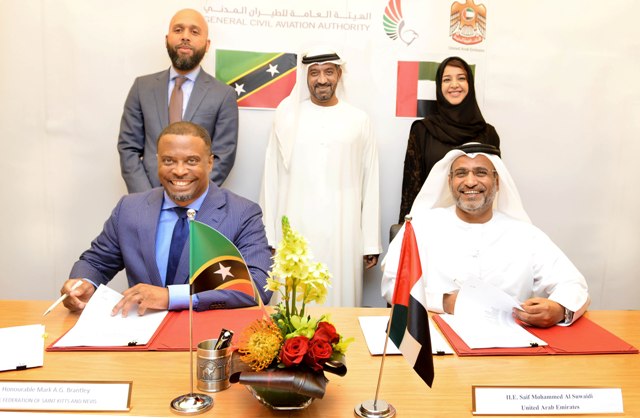 Foreign Affairs Minister in St. Kitts and Nevis Hon. Mark Brantley and His Excellency Saif Mohammed Al Suwaidi, Director General of the General Civil Aviation Authority (GCAA) signing the Agreement. Looking on are (standing l - r) C.G Hawley, Sheikh Ahmed bin Saeed Al Maktoum - Chairman of Dubai Civil Aviation Authority and CEO and Chairman of the Emirates Group and Chairman of Dubai World and Her Excellency Reem Al Hashimi - Minister of State and cooperation Managing Director of EXPO 2020.